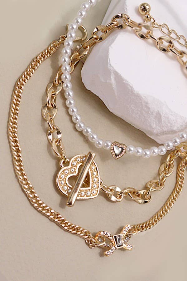 CONJUNTO DE PULSERA DE 3 FILAS DE PERLAS BOW HAERT | 80B217