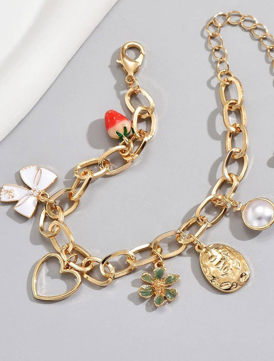 PULSERA CON PERLA DE FRESA Y LAZO CON ENCANTO | 80B260